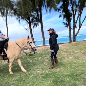 Turtle Bay Horseback Riding - Miss Kylie being awesome talking with the 7 year old but really making sure by her body language she is comfortable. - Horseback Riding Near Me - Kahuku, Hawaii Turtle Bay Horseback Riding - Miss Kylie being awesome talking with the 7 year old but really making sure by her body language she is comfortable. - Horseback Riding Near Me - Kahuku, Hawaii
