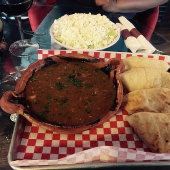 Balkan Cafe & Grill - gulas beef stew and salad under all of that cheese and the bread didn't disappoint - Modern European Near Me - Austin, Texas