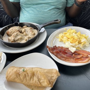 Hash Kitchen - Biscuits and gravy, scrambled eggs n a side of bacon There are corn tortillas on plate for next dish - New American Near Me - Peoria, Arizona Hash Kitchen - Biscuits and gravy, scrambled eggs n a side of bacon There are corn tortillas on plate for next dish - New American Near Me - Peoria, Arizona