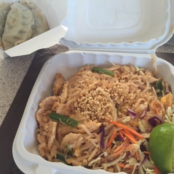 Busara Thai Cuisine - Chicken Phad Thai, with a wedge of lime, and an order of pot stickers to go - Thai Near Me - Bellingham, Washington Busara Thai Cuisine - Chicken Phad Thai, with a wedge of lime, and an order of pot stickers to go - Thai Near Me - Bellingham, Washington