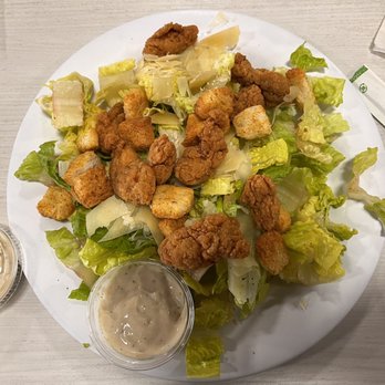 Stinger Ray's Tropical Bar & Grill - Crispy chicken Caesar-tastes way better then it looks! - Bars Near Me - Honolulu, Hawaii Stinger Ray's Tropical Bar & Grill - Crispy chicken Caesar-tastes way better then it looks! - Bars Near Me - Honolulu, Hawaii
