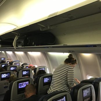 United Airlines - Watch out, United will charge $65 dollars to put your carry-on under the plane if you are in Group 5! Even with all this room! - Airlines Near Me - San Jose, California