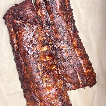 Capt Crab Seafood + BBQ - Fall-off-the-bone ribs slow-smoked to perfection, brushed with our signature BBQ sauce that's the perfect balance of sweet, smoky, and tangy - Barbeque Near Me - York, Pennsylvania