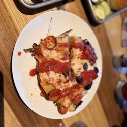 Pizza isn't in the best shape but it tastes good.