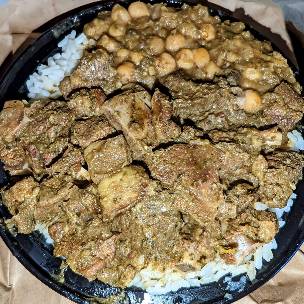 D Roti Hut - Curried goat over rice w.chickpeas $14 - Caribbean Near Me - Queens Village, New York D Roti Hut - Curried goat over rice w.chickpeas $14 - Caribbean Near Me - Queens Village, New York