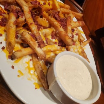 Outback Steakhouse - Appetizer:  cheesy fries $9.99. Best dipping sauce ever. - Steakhouses Near Me - Jackson, Tennessee