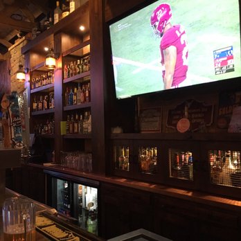 Stockmans Bar - a football game being played on tv - Sports Bars Near Me - Layton, Utah