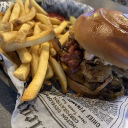 Stag over burger and fries with a pickle! 1/2# burger, cheddar cheese, bacon, fried egg and sriracha aioli! Delicious!!!!