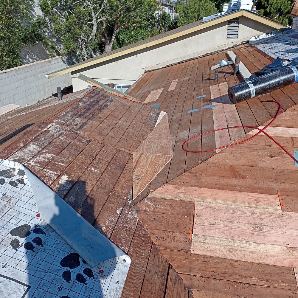 Accurate Roofing Solutions - The diamond shaped wood is a chute to channel rain water away from a level valley. - Roofing Near Me Accurate Roofing Solutions - The diamond shaped wood is a chute to channel rain water away from a level valley. - Roofing Near Me