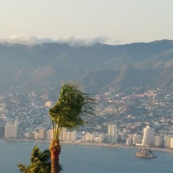 Acapulco For All - Clouds spilling over the mountains - Tours Near Me