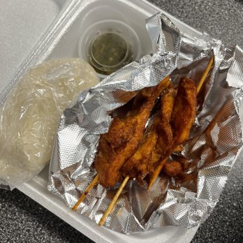 JP Lao Kitchen - Chicken on a stick w/ sticky rice and chili paste :) - Thai Near Me - Charlotte, North Carolina