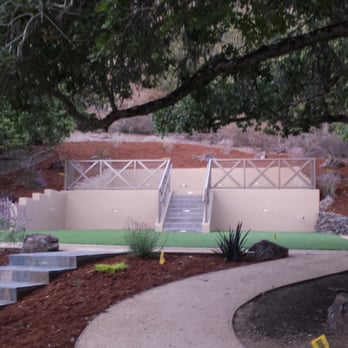 Garden Solutions Landscaping - Lovely terraced backyard with drought tolerant plants and synthetic turf for children's play areas - Landscaping Near Me Garden Solutions Landscaping - Lovely terraced backyard with drought tolerant plants and synthetic turf for children's play areas - Landscaping Near Me