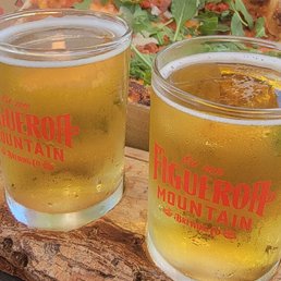 Figueroa mountain Mexican lager beer. Lucky penny pizza in the background