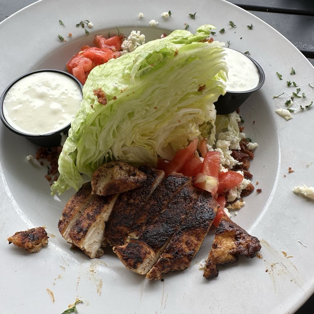 Wedge salad with blackened chicken.
