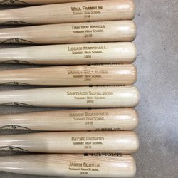 Custom Laser Engravers - Baseball bats engraved for high school players.