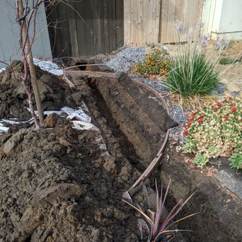 TLC Landscape Services - Trenching into the front yard. - Landscaping Near Me