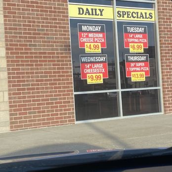 Mad Mushroom - a storefront window with specials - Pizza Near Me - Lexington, Kentucky Mad Mushroom - a storefront window with specials - Pizza Near Me - Lexington, Kentucky