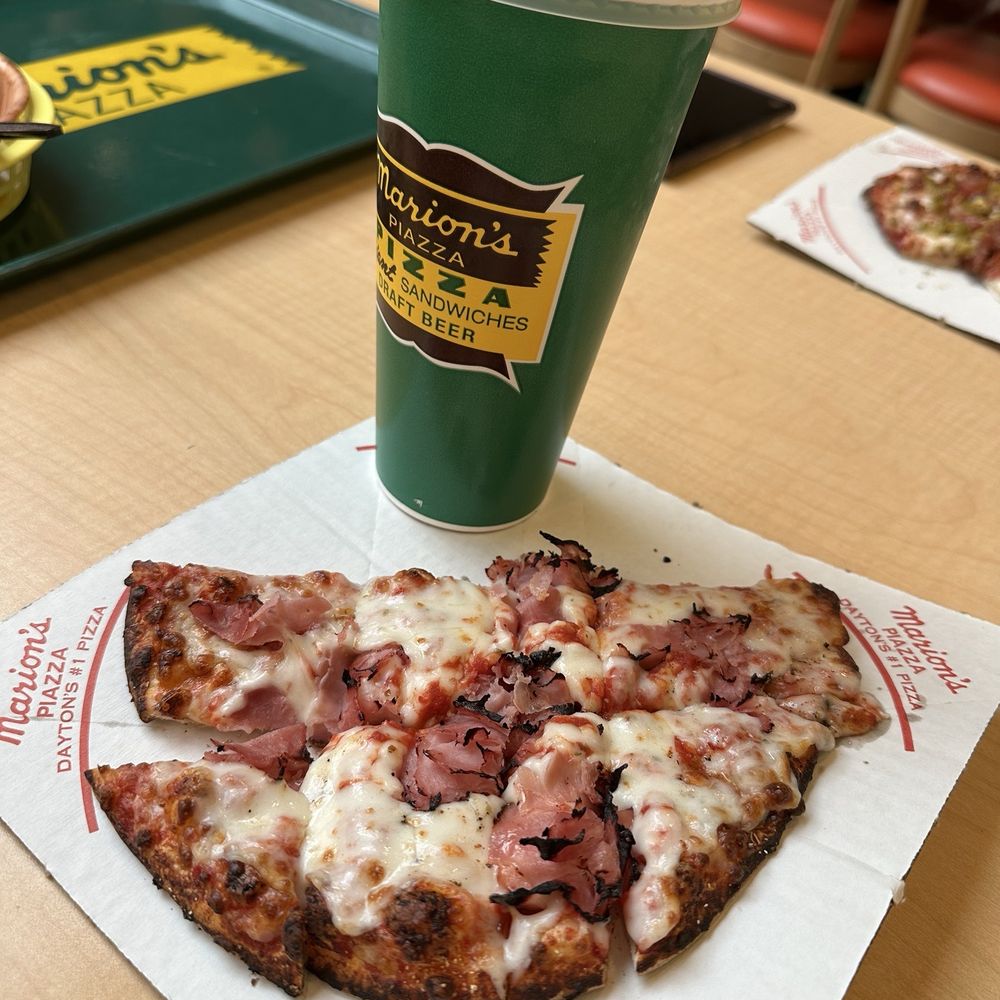 My lunch special for $5.99 - a soda and half of a pizza, with extra cheese and ham. My lunch special for $5.99 - a soda and half of a pizza, with extra cheese and ham.