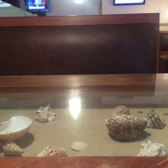 Baccailis Cafe - Table have embedded, display of seashells and sand. Different. - American Near Me - Katy, Texas Baccailis Cafe - Table have embedded, display of seashells and sand. Different. - American Near Me - Katy, Texas