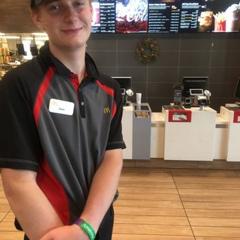 McDonald's - a young man standing in front of a counter - Fast Food Near Me - Platteville, Wisconsin McDonald's - a young man standing in front of a counter - Fast Food Near Me - Platteville, Wisconsin