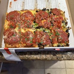 Joe's Pizza - Detroit Style Pizza Half plain, half with mushroom, green pepper and black olives