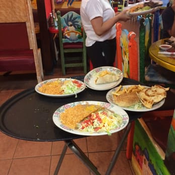 Torero's - A selection of a few of the meals being delivered to a table nearby - Mexican Near Me - Roxboro, North Carolina