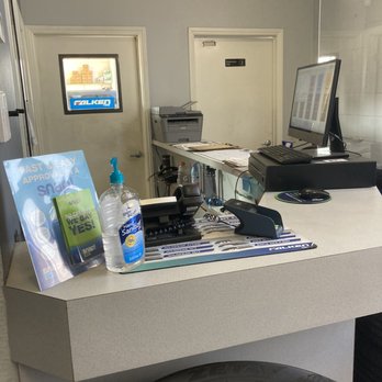 Wheel Maxx - cashier with hand sanitizer - Oil Change Stations Near Me - Fresno, California