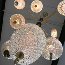 Karkula - Chandelier by Michelle James using vintage glass globes on patinated brass frame.