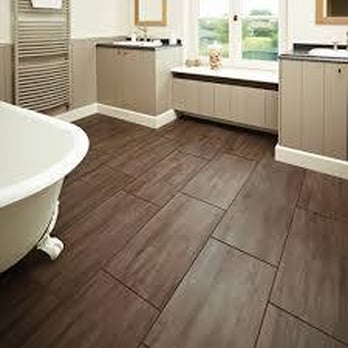 Caribe Construction - Faux wood flooring using ceramic tiles. - General Contractors Near Me - Miami, Florida