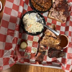 Famous Dave's Bar-B-Que - Three meat combo platter after we started to dig in.