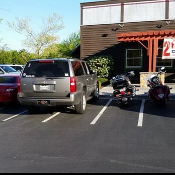 Logan's Roadhouse - Another pic of the same at a different angle. The car on the left end is just squeezed in - Barbeque Near Me - Cleveland, Tennessee Logan's Roadhouse - Another pic of the same at a different angle. The car on the left end is just squeezed in - Barbeque Near Me - Cleveland, Tennessee