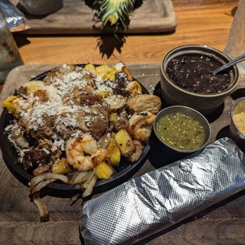 Tlahcos - The pork and shrimp with coconut sauce - Mexican Near Me - Plainfield, Indiana