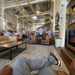 Relaxing on their chairs. View of the bar and inside.