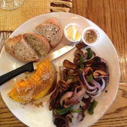 Coffee rubbed steak with sauté onion, peppers, and mushrooms. Acorn squash and bread.