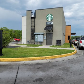 Starbucks - a parking lot with cars parked in front of it - Coffee & Tea Near Me - Chesapeake, Virginia