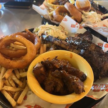 Phil's BBQ - baby back rib tickler which came with 3 bones. Added a beef rib, rib-less, and a sausage link. - Barbeque Near Me - San Diego, California Phil's BBQ - baby back rib tickler which came with 3 bones. Added a beef rib, rib-less, and a sausage link. - Barbeque Near Me - San Diego, California