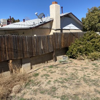 Aaa Lujan Landscaping - a view of a fenced in yard - Landscaping Near Me