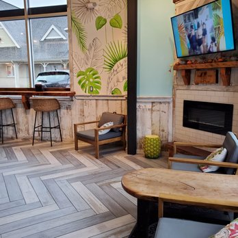 Playa Bowls - a living room with a tv and a fireplace - Juice Bars & Smoothies Near Me - Newtown, Pennsylvania Playa Bowls - a living room with a tv and a fireplace - Juice Bars & Smoothies Near Me - Newtown, Pennsylvania