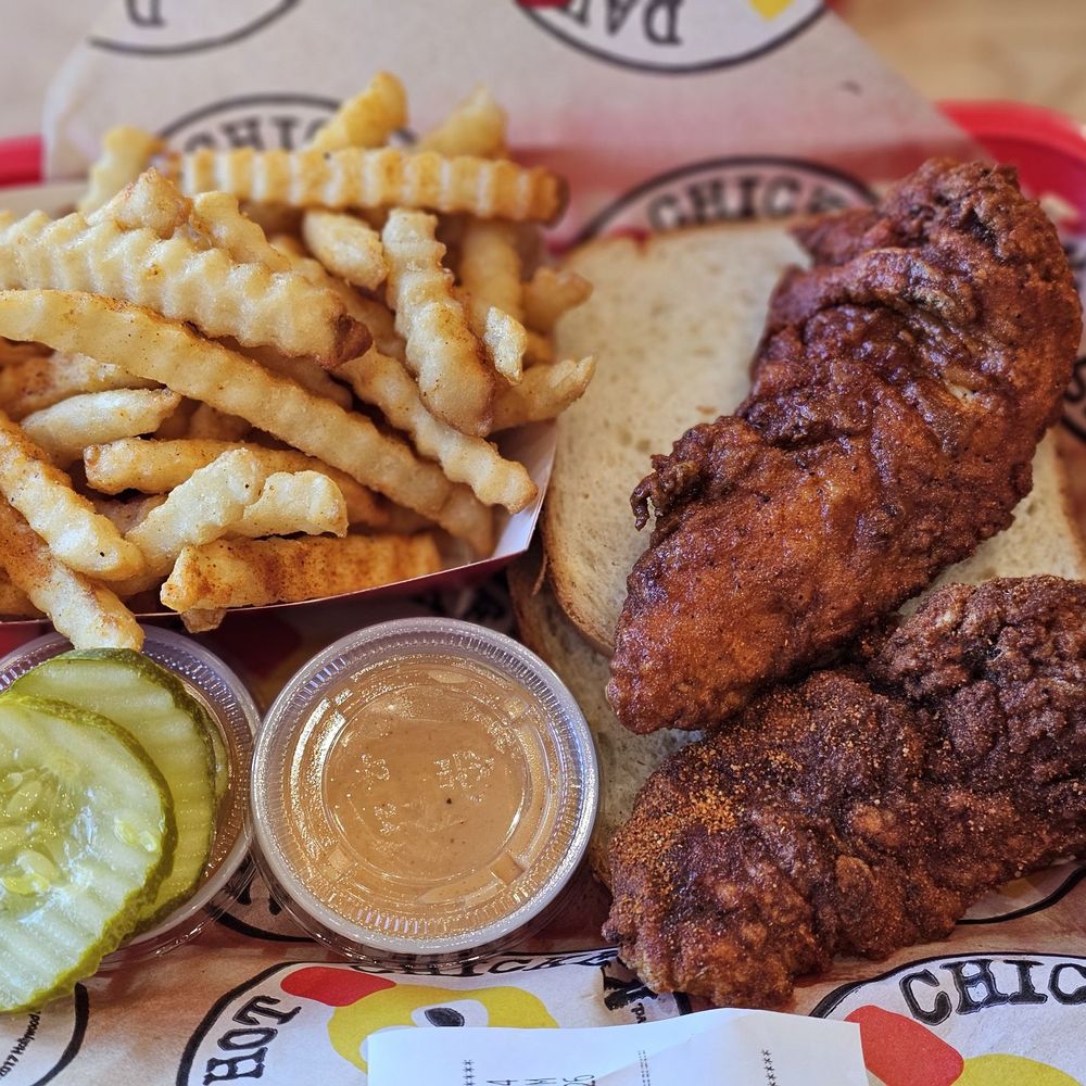Dave's Hot Chicken - 2 tenders and fries, top one hot and very hot just underneath. - Chicken Shop Near Me - Yukon, Oklahoma Dave's Hot Chicken - 2 tenders and fries, top one hot and very hot just underneath. - Chicken Shop Near Me - Yukon, Oklahoma