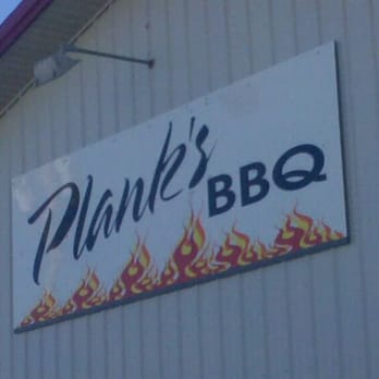Plank's Barbeque - a sign on the side of a building - Barbeque Near Me - Garden City, Kansas