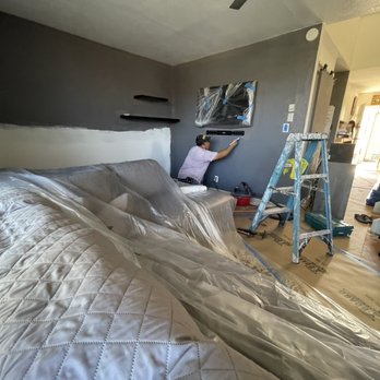 Ohana Restoration - Painting and sanding! You can see how lightly the furniture is covered - Damage Restoration Near Me - Honolulu, Hawaii