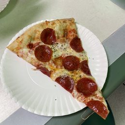 Pepperoni slice, with added oregano and garlic powder. Pepperoni slice, with added oregano and garlic powder.