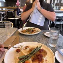 The Landing Restaurant - Haddock, purse parsnip, asparagus in front. Munk fish, risotto, squash in back. Both so so delicious.