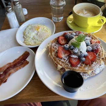 Poached Kitchen - That's not a food shot, it's my breakfast!  The waffles are delicious and the quality of the eggs and bacon were on point. - Breakfast & Brunch Near Me - Irvine, California