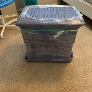Movers League - Wrapping up a nightstand for maximum protection. - Movers Near Me - Cedar Park, Texas