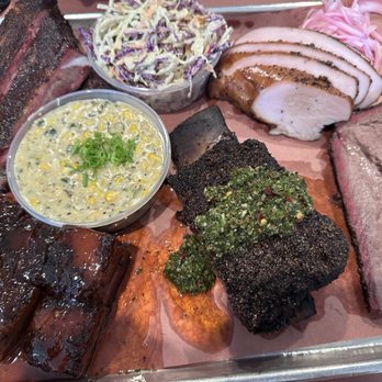 Interstellar BBQ - Peach glazed pork belly, pork ribs, creamed corn, jalapeños slaw, turkey, brisket and chimichurri beef rib. - Barbeque Near Me - Austin, Texas