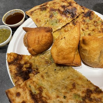 Food Belly - (2) aloo samosas and (1)keema (beef) samosa, (1) paratha (more like pizratha), green chutney, and tamarind-date chutney - Indian Near Me - Corsicana, Texas