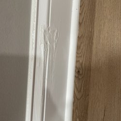 Green State Pro - Damaged baseboard which was just painted over.