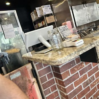 The SmoKING Ribs - Smoker behind the register, terrible pic I know, sorry. - Caterers Near Me - Garden Grove, California