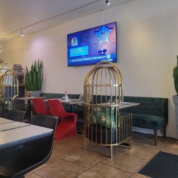 Baan Thai - Small tables and chairs for seating and a big booth for opposite side of the chairs. - Thai Near Me - Santa Maria, California